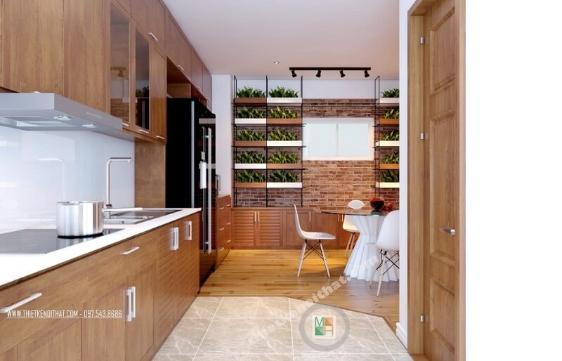 Hệ thống tủ bếp gỗ thiết kế đơn giản, hiện đại kéo dài tạo đô thoáng cho không gian mà vô cùng tiện dụng.  Thiết kế tủ bếp chung cư