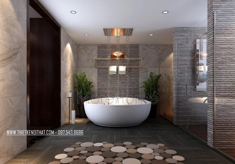 Để tạo cảm giác không gian thoáng rộng hơn, KTS đã chọn đá tự nhiên ốp tường vân mây để thu hút ánh sáng vào phòng tắm.